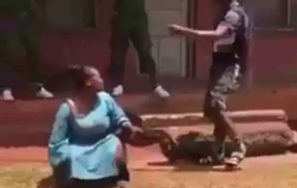 Nigerian Soldier Beats His Lover Mercilessly In Public For Lying To Him (Photos)